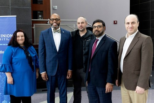 Batten College of Engineering representatives Vukica Jovanovic, left, Nathan Luetke, Khan Iftekharrudin, and Hamid Eisazadeh pose with President Brian O. Hemphill, Ph.D., after the ceremony.
